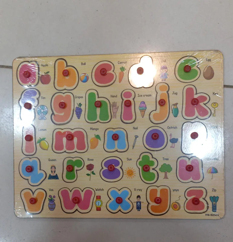 Colorful alphabet puzzle with letters and pictures on a white surface