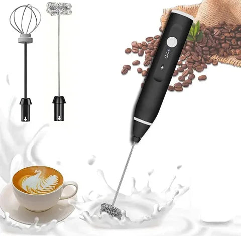 Black handheld milk frother with attachments on a white background with coffee beans and a cup of coffee.