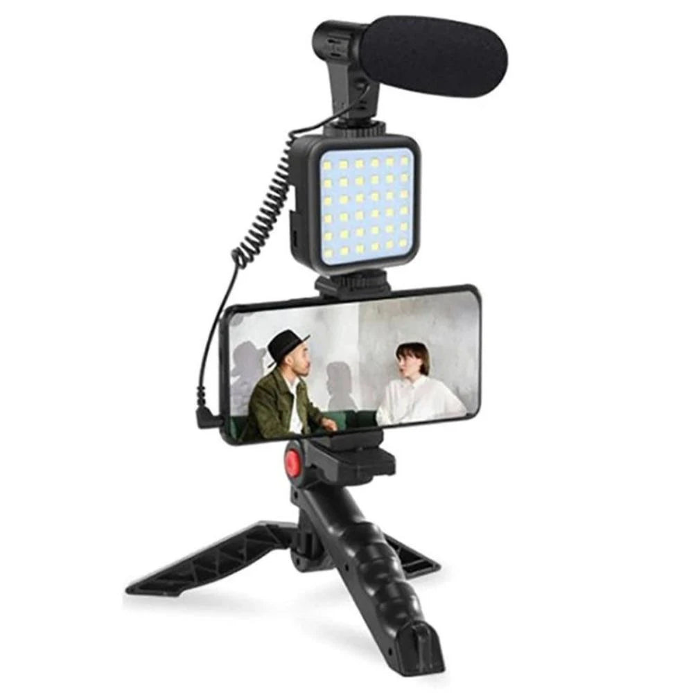 Video recording setup with microphone, light, and smartphone on a white background