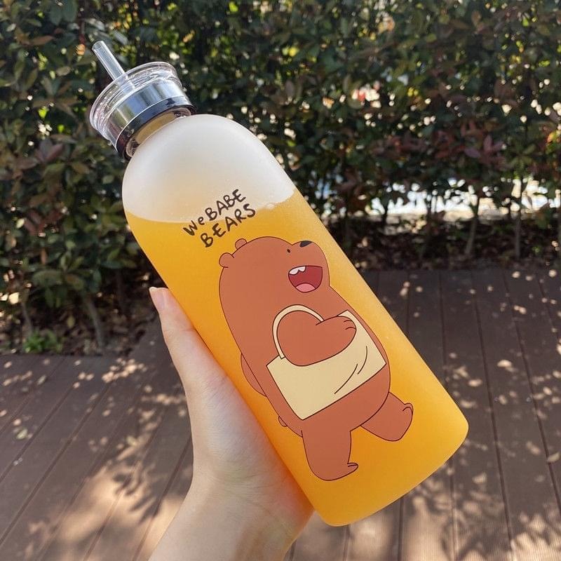 Hand holding a water bottle with a cartoon bear design and 'We Bare Bears' text.