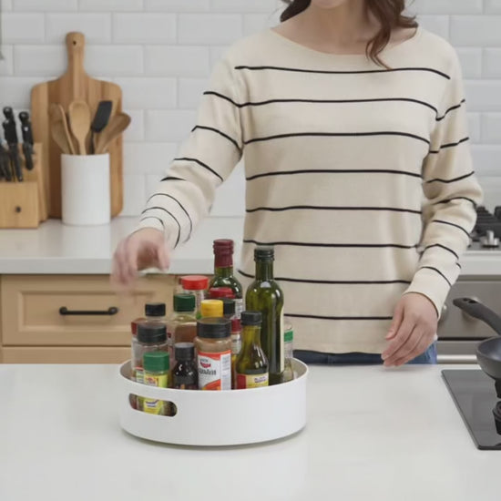 Video showing rotating kitchen and dining table storage box organizer with open handle in use