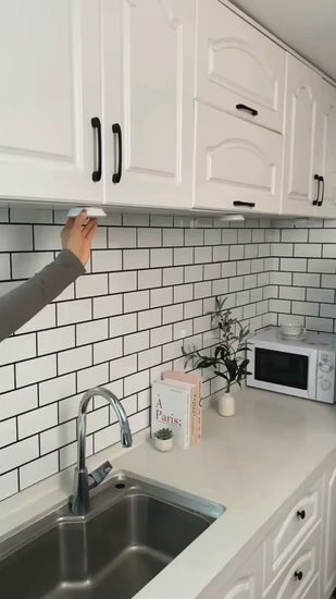 Video showing wireless LED remote control shelf lights illuminating cabinet and display shelves