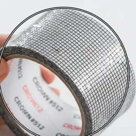 Close-up of a roll of mesh tape with a white label.