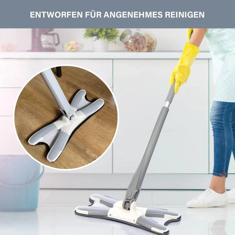 Person cleaning a kitchen floor with a mop, wearing yellow gloves.