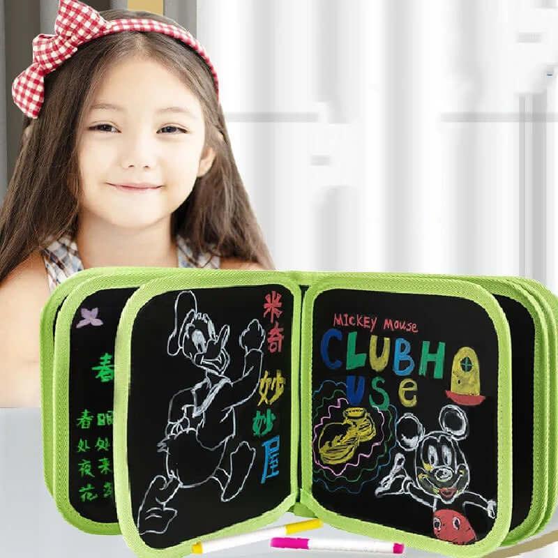 Kids erasable doodle magic book with 3 color markers being used for drawing.