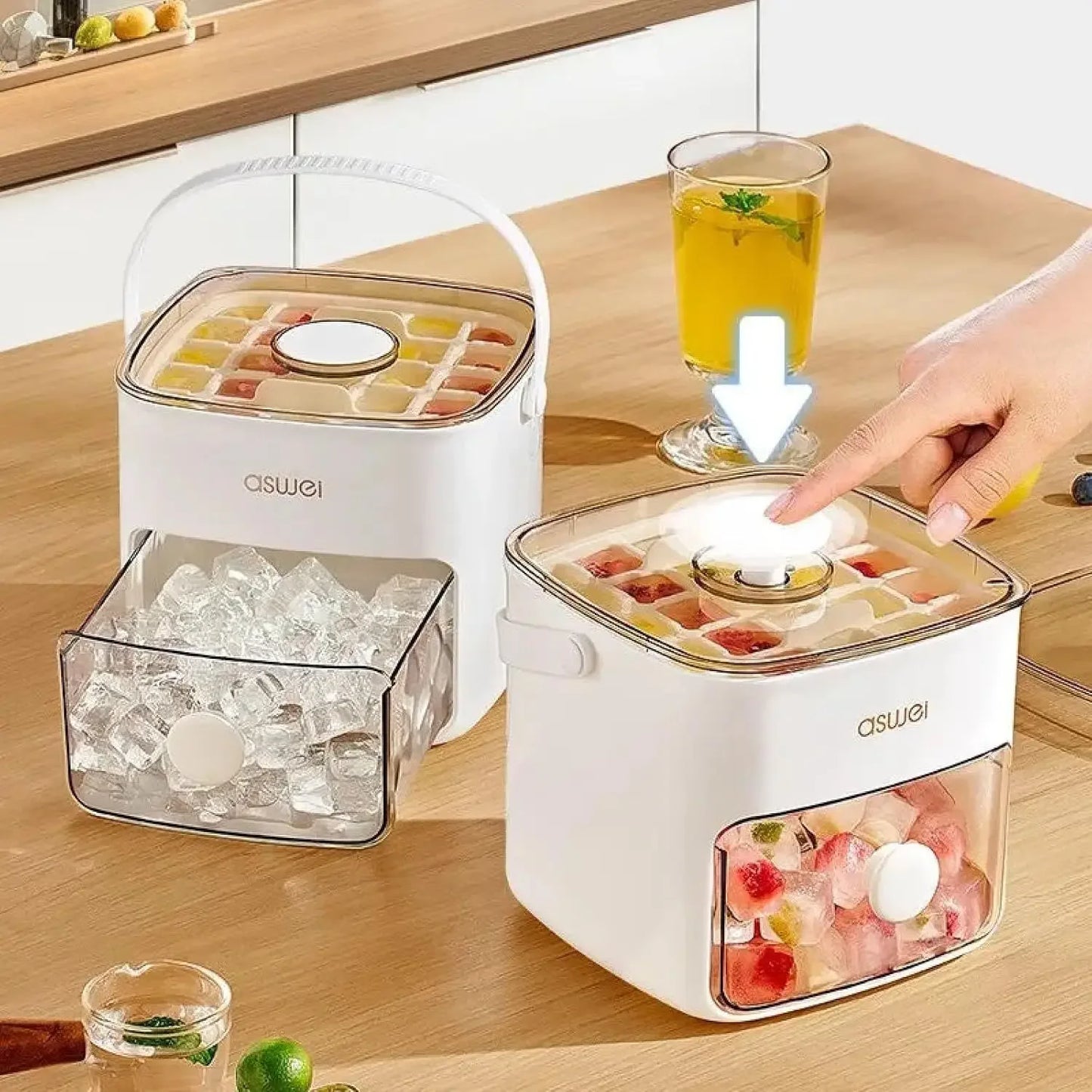 ASWEL ice cube maker with ice cubes and a glass of juice on a wooden table.