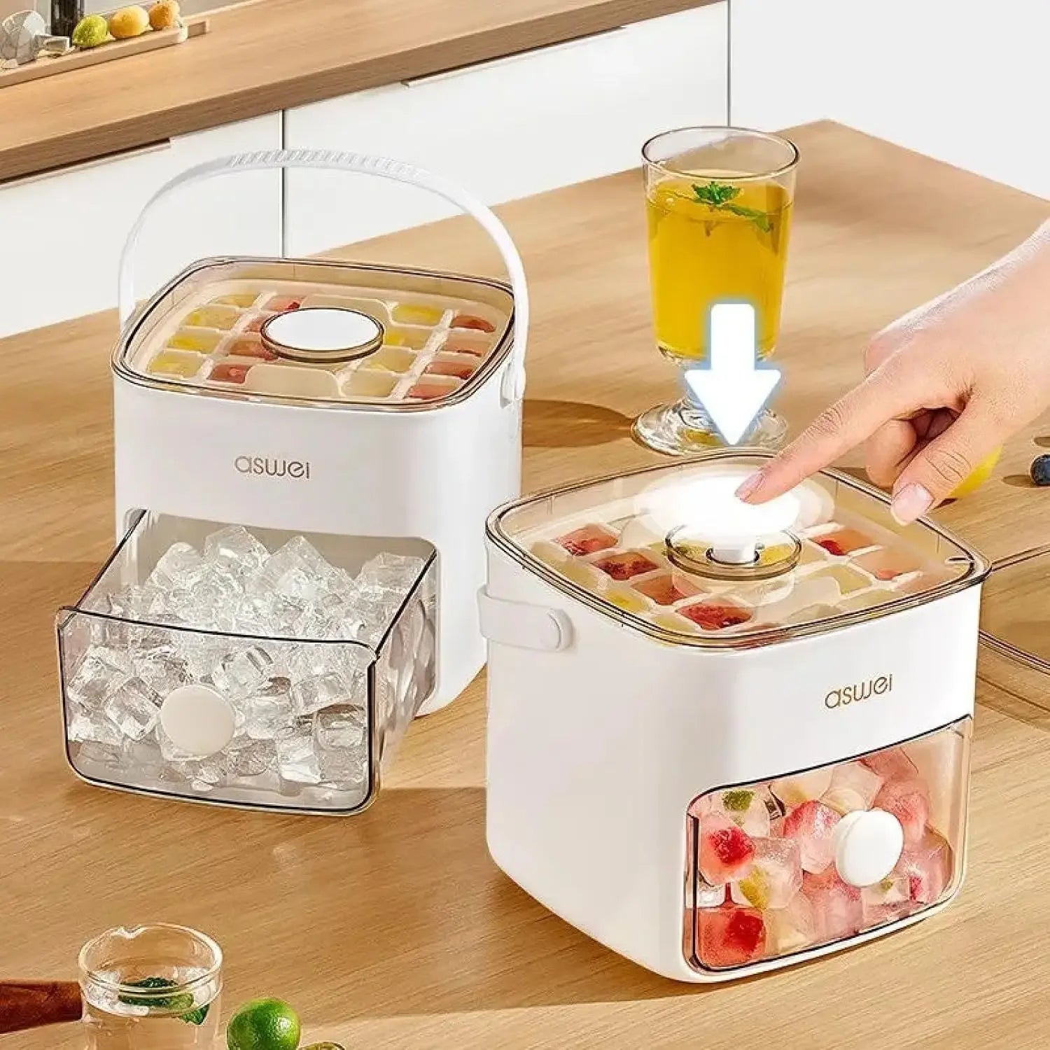 ASWEL ice cube maker with ice cubes and a glass of juice on a wooden table.