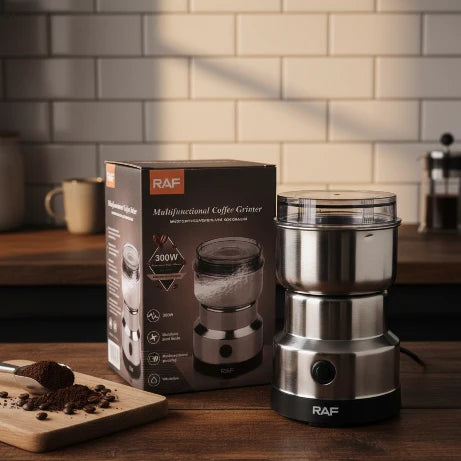 RAF multifunctional coffee grinder on a wooden surface with packaging in the background.