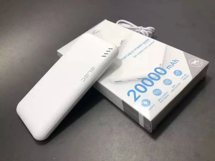 White power bank with '20000 mAh' label on a dark surface