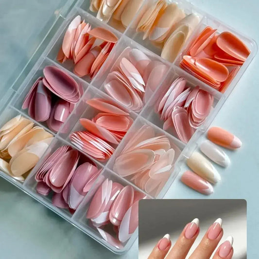 Set of nail extensions in various colors in a clear organizer with a close-up of applied nails.