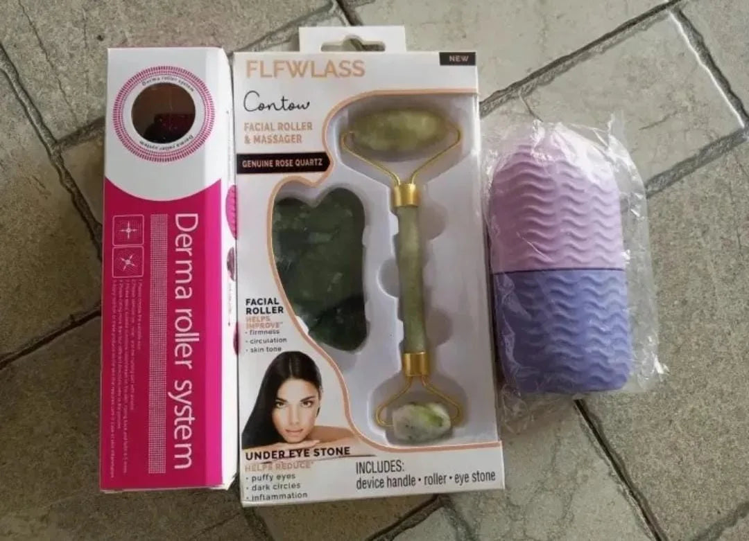 Derma roller system and facial roller with packaging on a tiled floor.