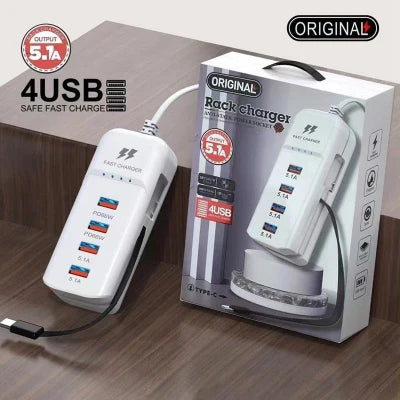 White 4-USB charging device with packaging on a wooden surface