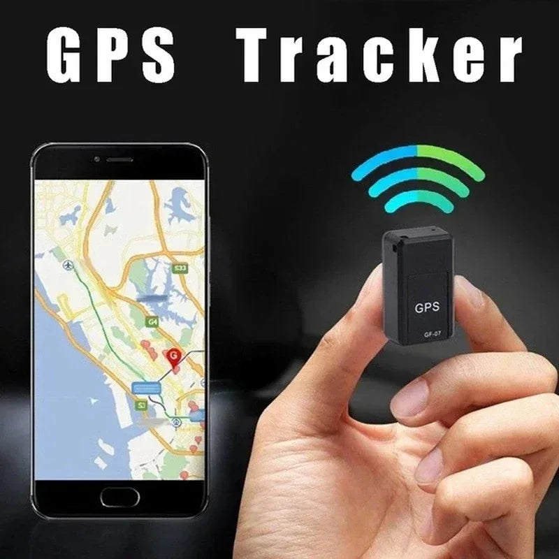 GPS tracker device held in a hand with smartphone displaying map and GPS tracking app.