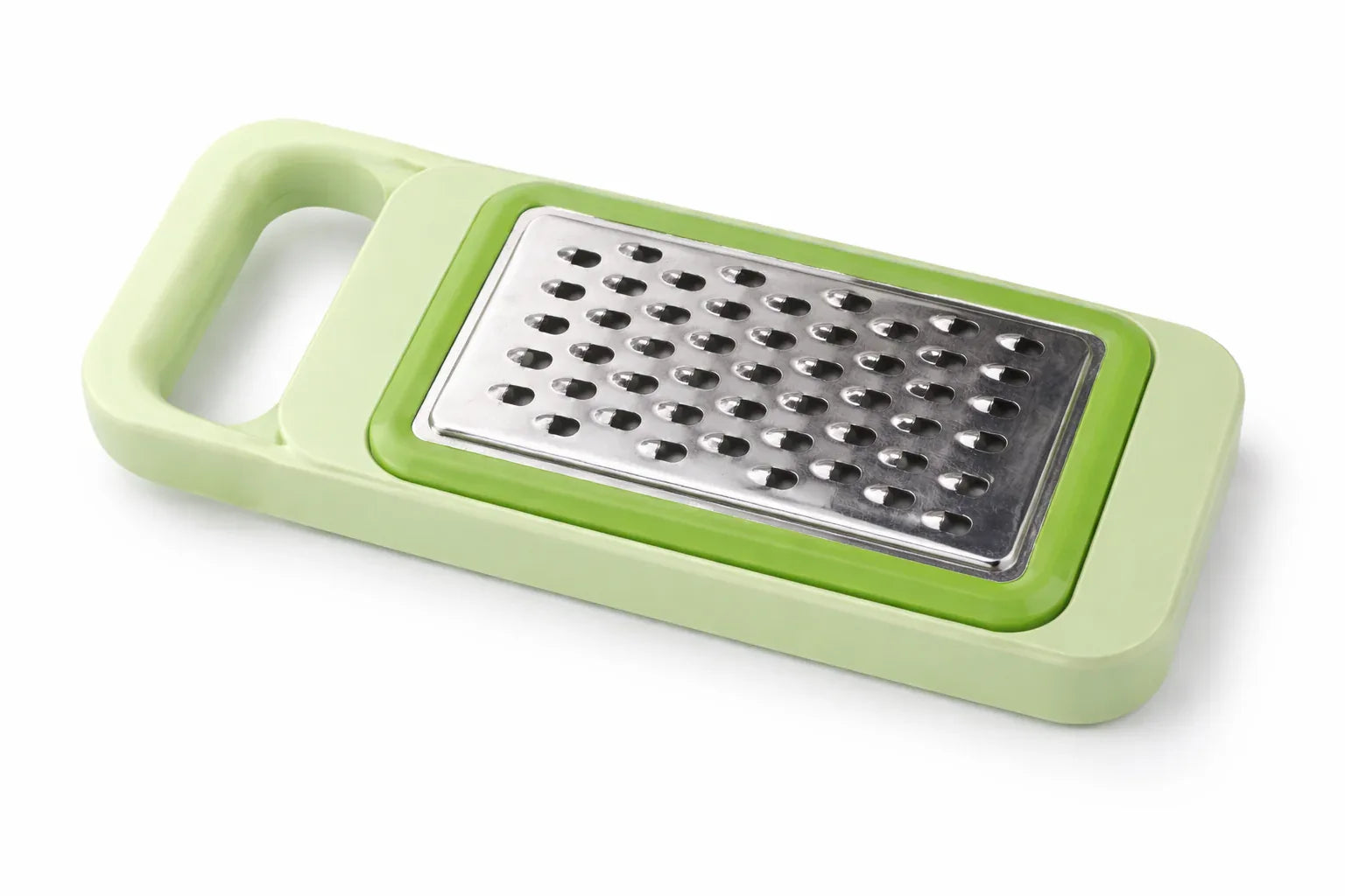 Green handheld grater on a white background