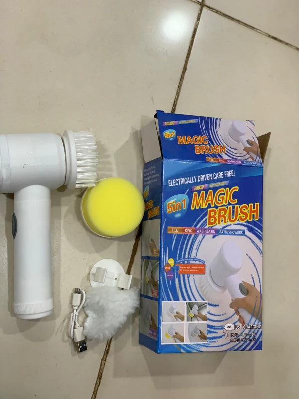 Magic Brush cleaning tool with packaging, brush head, and charging cable on a tiled floor.