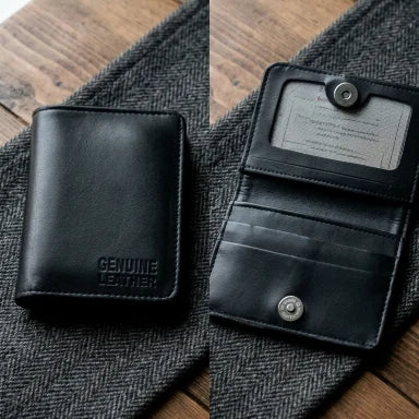 Black leather wallet with 'Genuine Leather' label on a textured fabric background