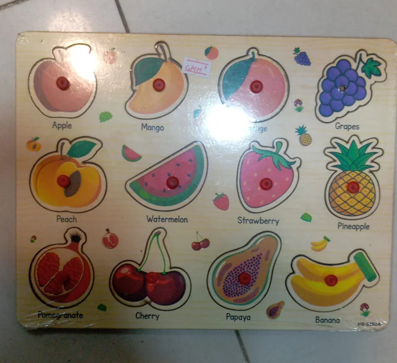 Wooden puzzle with illustrations of fruits on a white surface