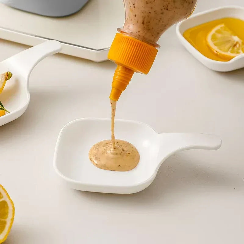 7-piece set of polished white plastic sauce dishes arranged on a wooden dining table for steak sauce and seasonings.