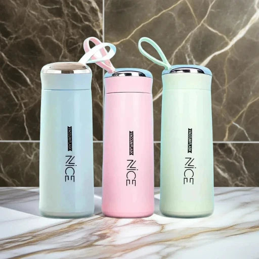 Three insulated bottles in pastel colors with 'NICE' branding on a marble surface.