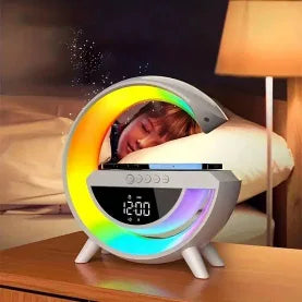 Colorful LED clock on a bedside table with a person sleeping in the background