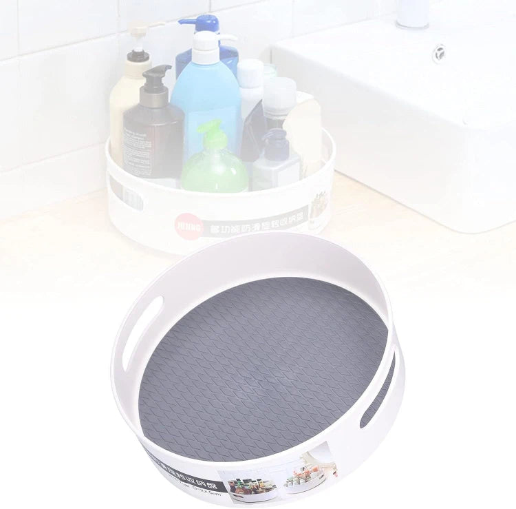Round gray mat on a white surface with cleaning supplies in the background