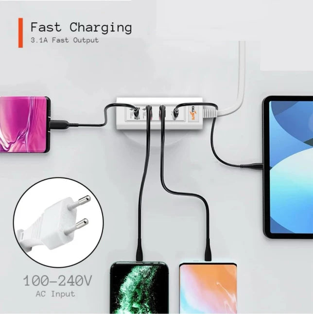 Multiple electronic devices being charged from a power strip with fast charging text.