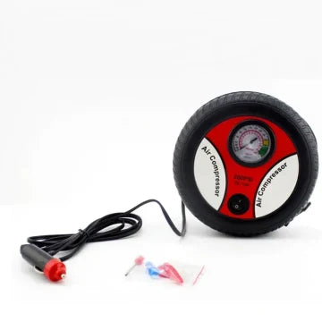 Air compressor with gauge and accessories on a white background