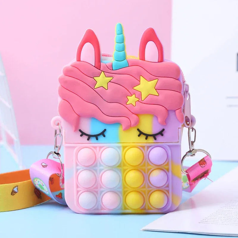 Colorful unicorn-themed phone case with pop-it feature on a light blue background