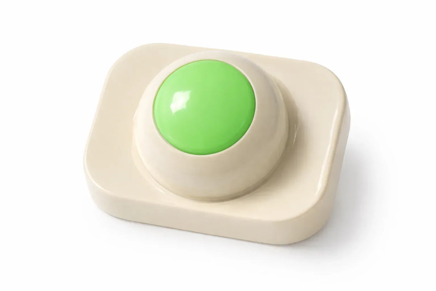 Beige square button with a green center on a white background