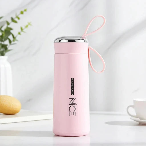Pink insulated bottle with a strap on a light background