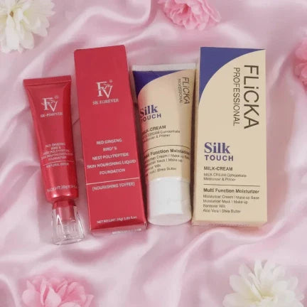 Cosmetic products including a red tube, red box, beige tube, and beige box on a pink fabric background with flowers.