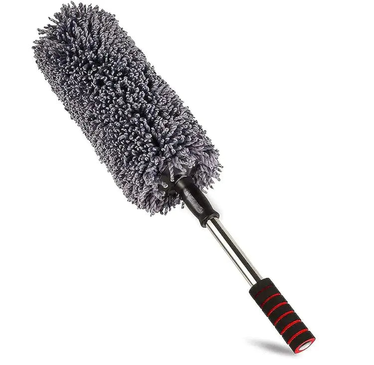 Microfiber cleaning duster with extendable handle on a white background